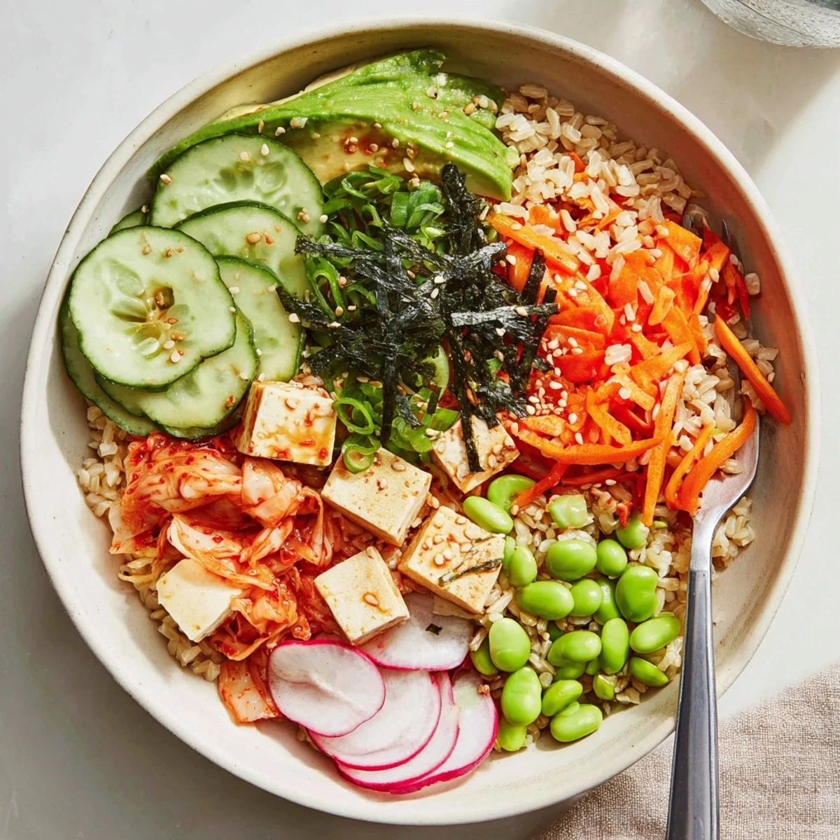 Wholesome fermented vegetable bowl with grains, tangy kimchi, and seasonal veggies.
