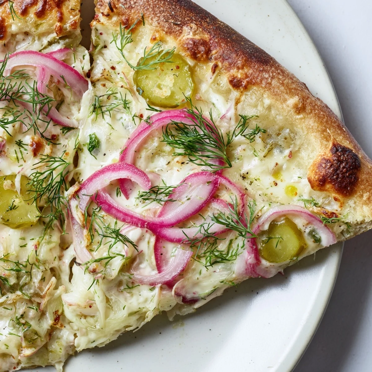 Deliciously unique Pickle Pizza with mozzarella and zesty dill, perfect for sharing.  
