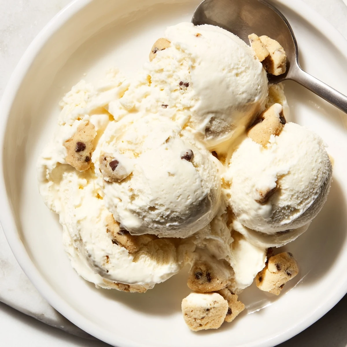 Creamy cottage cheese ice cream swirled with indulgent cookie dough bites.  