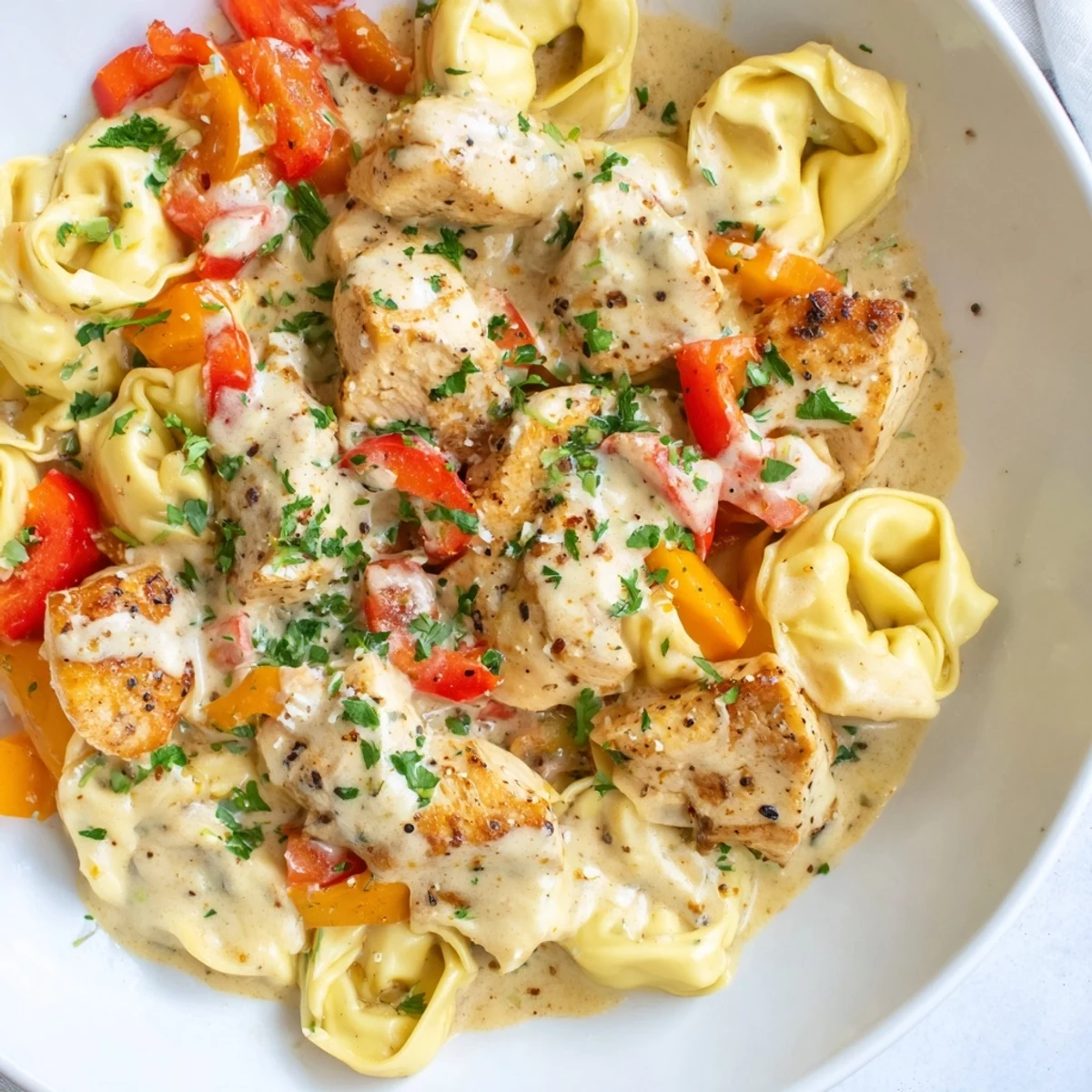 Savor the flavors of Zesty Cajun Garlic Parmesan Chicken Tortellini, a perfect weeknight meal with cheesy pasta.