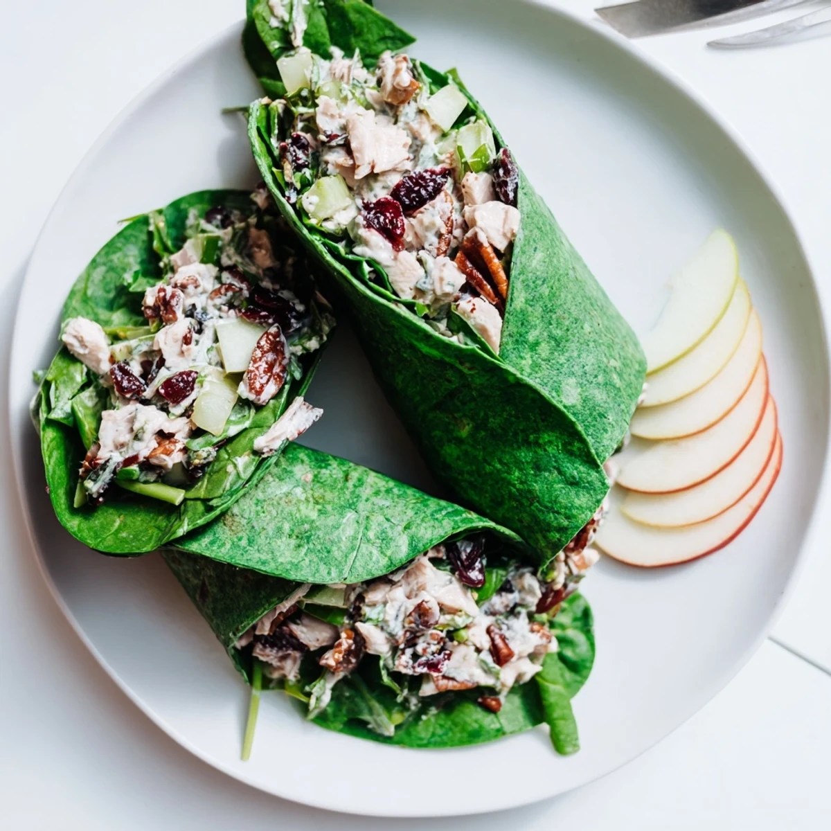 A close-up of a festive Cranberry Pecan Chicken Salad Christmas Wrap, perfect for a holiday lunch.