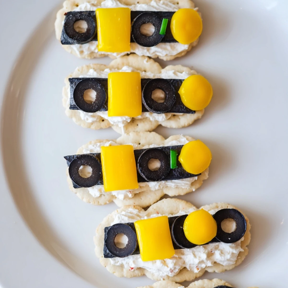 Festive Santas Belt Crackers & Dip: Buttery crackers, cheddar cheese belts, and creamy red pepper dip ready to enjoy.