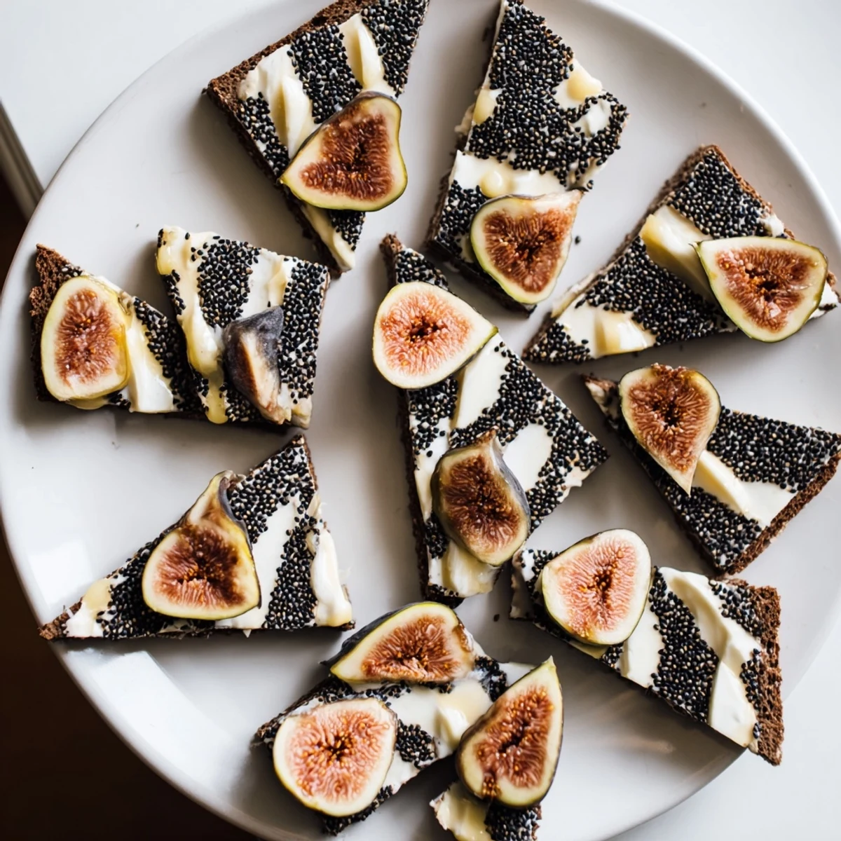 Elegant platter of Black and White Formal Affair appetizer, featuring olives, mozzarella, and geometric rye bread.