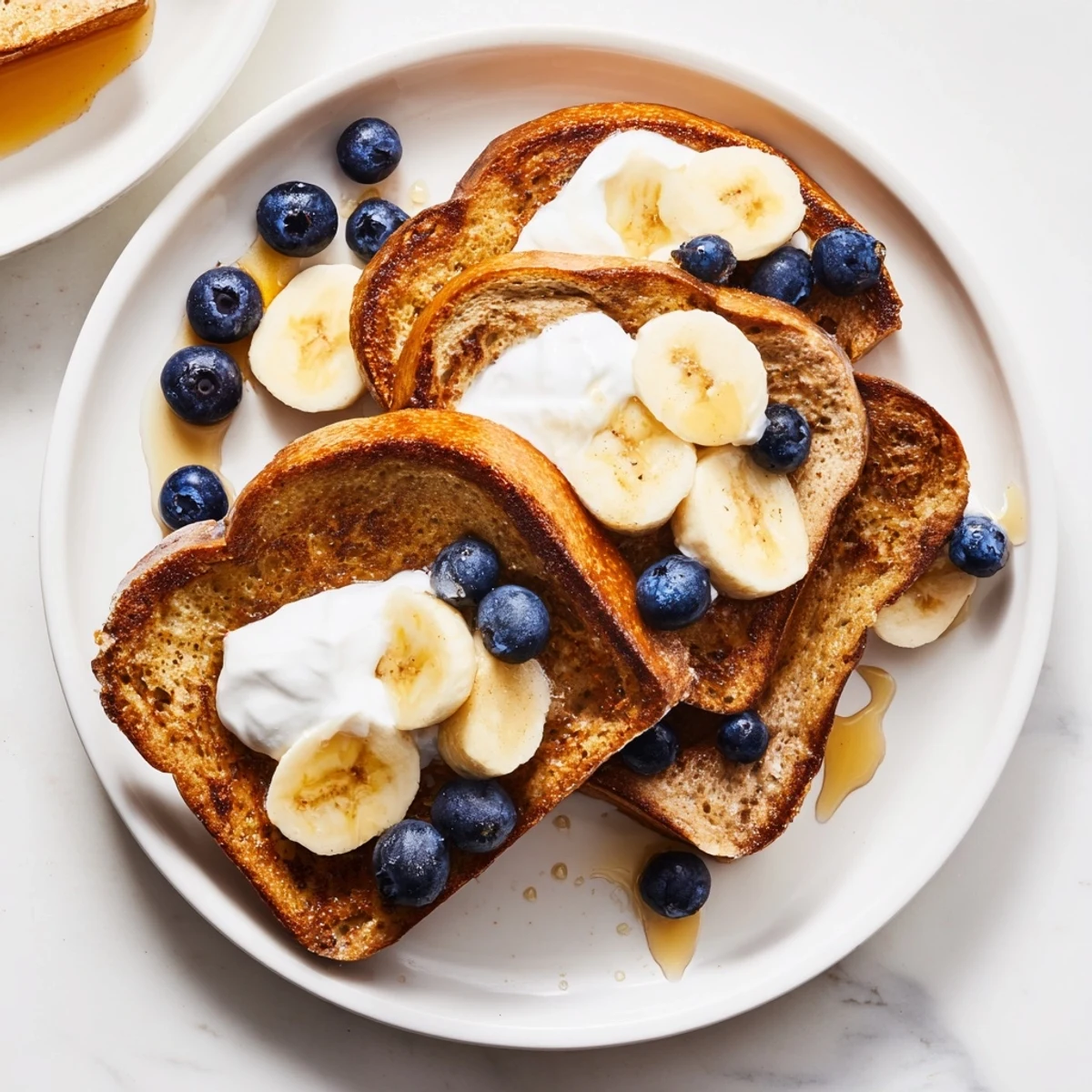 Golden-brown Protein French Toast, topped with fresh berries, offering a delightful and healthy breakfast.