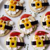 Holiday appetizer of Santas Belt Crackers & Dip: Round crackers adorned with cheese and olive belt details.