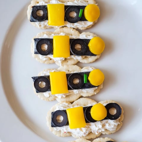 Festive Santas Belt Crackers & Dip: Buttery crackers, cheddar cheese belts, and creamy red pepper dip ready to enjoy.