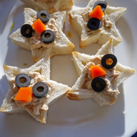 Mini Starfish Sandwiches: Adorable, ocean-themed appetizers with tuna, olives, and a zesty flavor profile.