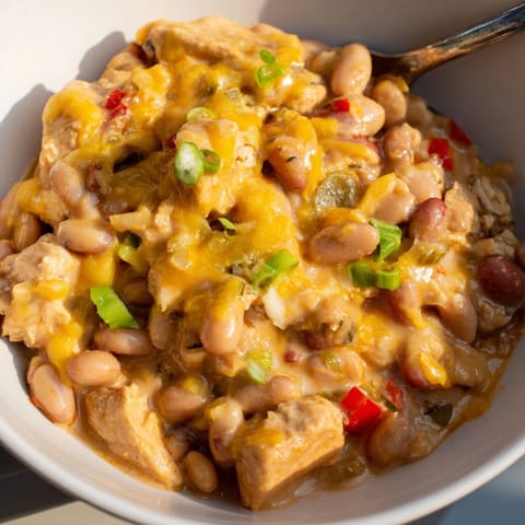 Savory Cajun Chicken Cheddar Pintos recipe: Creamy pinto beans with tender chicken and melted cheddar.