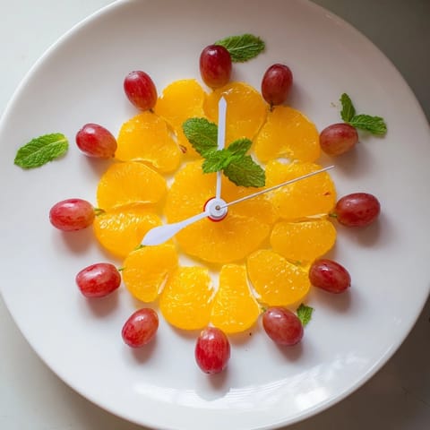 Sweet, juicy grapes and bright orange slices create a fun Grape and Orange Slice Clock Face for kids.