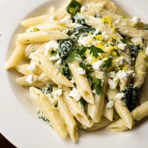 Fork twirling into Creamy Feta Spinach Pasta, with bright lemon zest and herbs crowning steaming, restaurant-worthy bowls.
