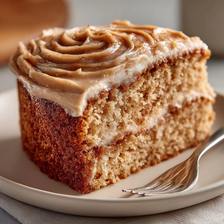 Homemade Applesauce Spice Cake: a flavorful autumn dessert with rich, creamy frosting.