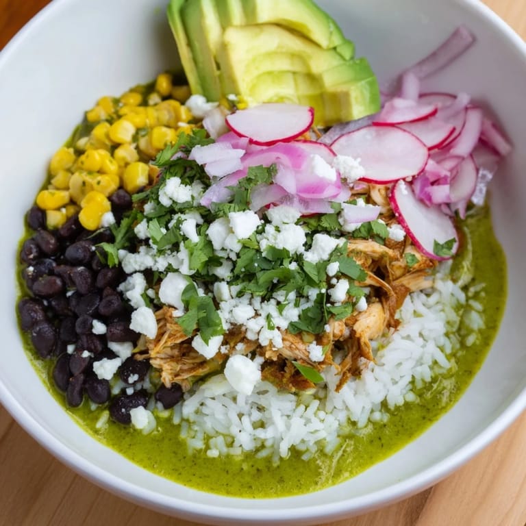 Bright, colorful Green Enchiladas Rice Bowl: a Tex-Mex delight with chicken, rice, and fresh cilantro.