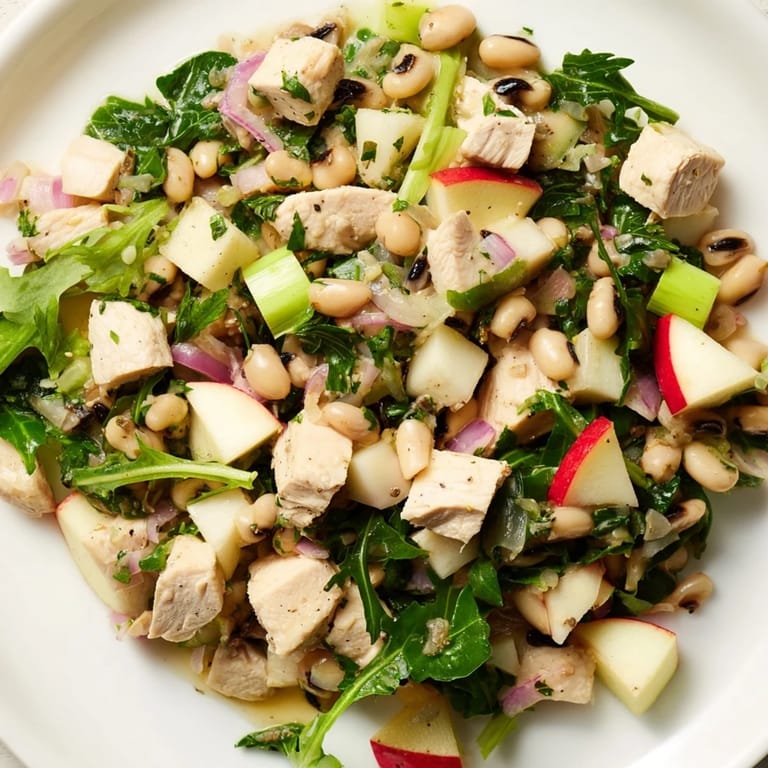 Vibrant Chicken and Apple New Years Luck Salad featuring tender chicken, crunchy apples, and black-eyed peas.